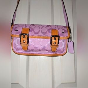 Coach Signature Mini field pink canvas leather crossbody bag.